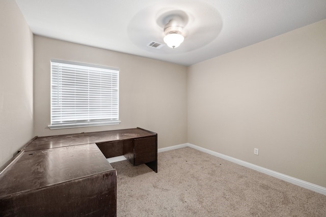 unfurnished office with light colored carpet and ceiling fan