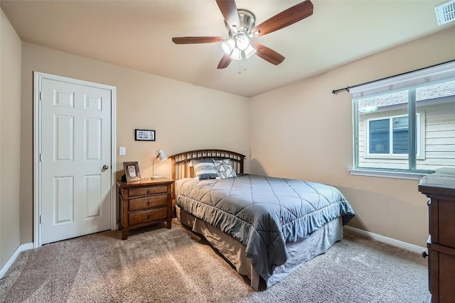 carpeted bedroom with ceiling fan