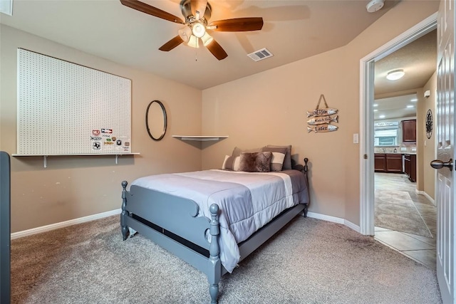 carpeted bedroom with ceiling fan