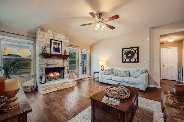 living room with a fireplace, wood-type flooring, ceiling fan, and lofted ceiling