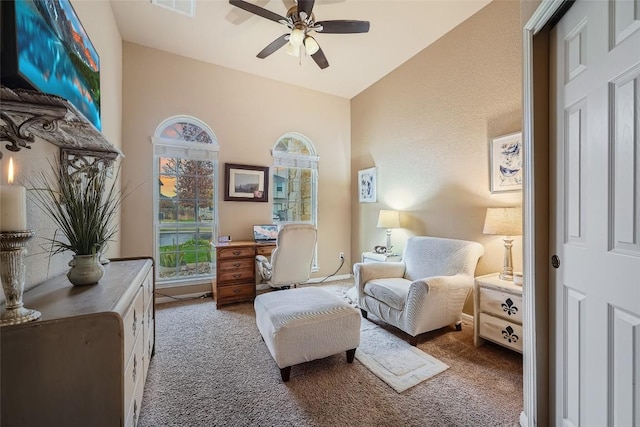 living area featuring ceiling fan, carpet floors, and high vaulted ceiling