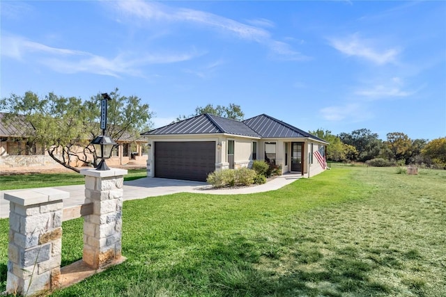 view of front facade featuring a garage and a front lawn