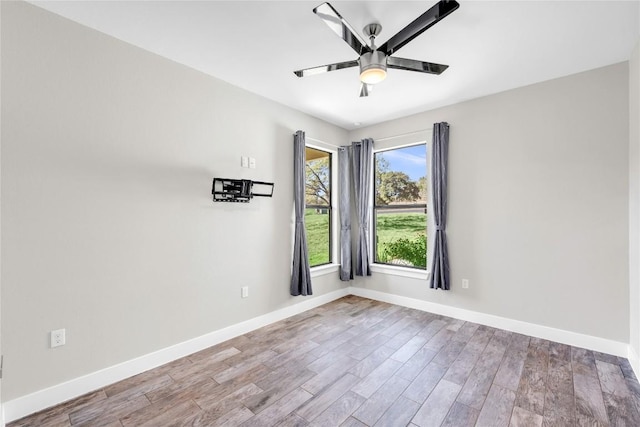 empty room featuring light hardwood / wood-style floors and ceiling fan