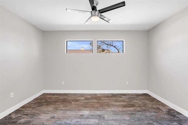 unfurnished room featuring ceiling fan and dark hardwood / wood-style flooring