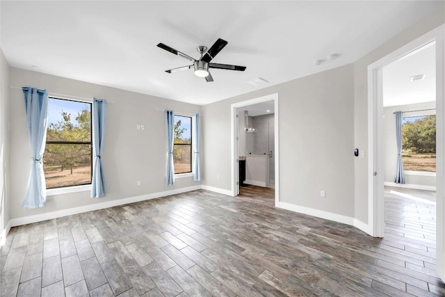 empty room with hardwood / wood-style flooring and ceiling fan