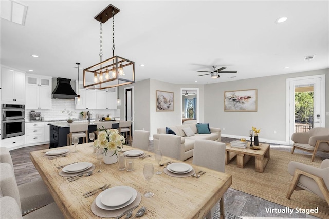 dining space with dark wood-type flooring and ceiling fan