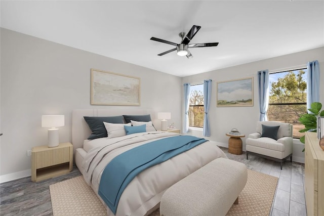 bedroom featuring hardwood / wood-style flooring and ceiling fan