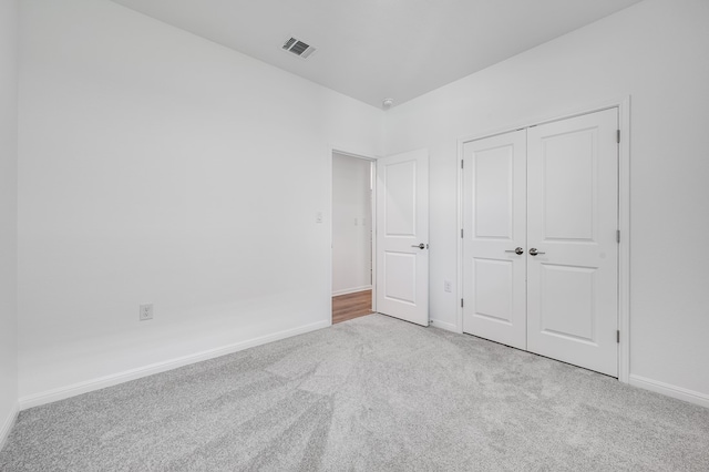 1804 Lorant Ln, Pflugerville, TX 78660 - unfurnished bedroom with carpet flooring, baseboards, and a closet