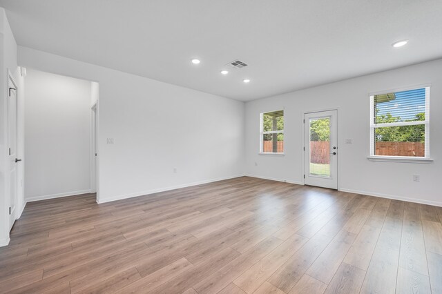 1804 Lorant Ln, Pflugerville, TX 78660 - empty room featuring light wood-style floors, recessed lighting, and baseboards