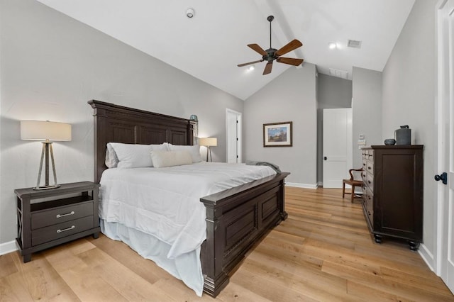 bedroom with light wood-type flooring, high vaulted ceiling, and ceiling fan