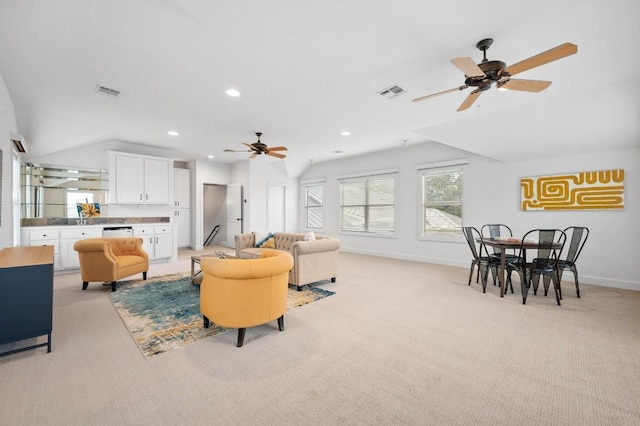 carpeted living room featuring ceiling fan