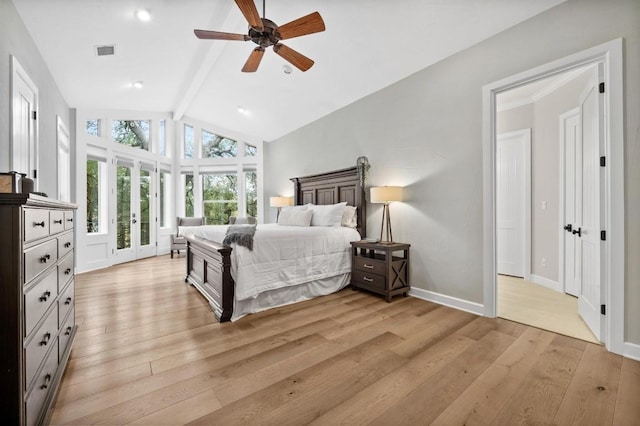 bedroom with ceiling fan, light hardwood / wood-style floors, access to outside, and lofted ceiling with beams