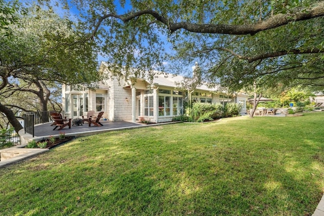 rear view of house with a lawn