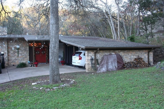 exterior space featuring a carport and a front yard