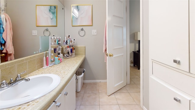 7 Hull Circle Dr, Austin, TX 78746 - bathroom with vanity, tile patterned floors, baseboards, and tasteful backsplash