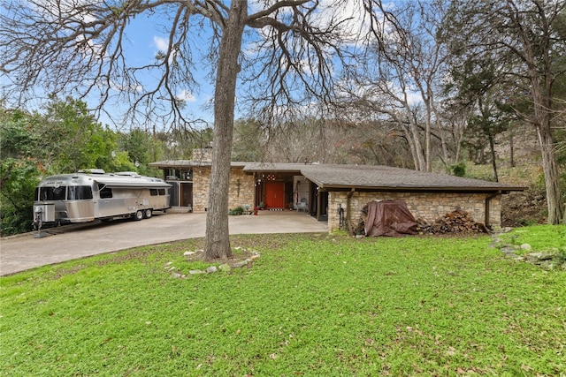 7 Hull Circle Dr, Austin, TX 78746 - view of front facade featuring stone siding, a front lawn, and driveway