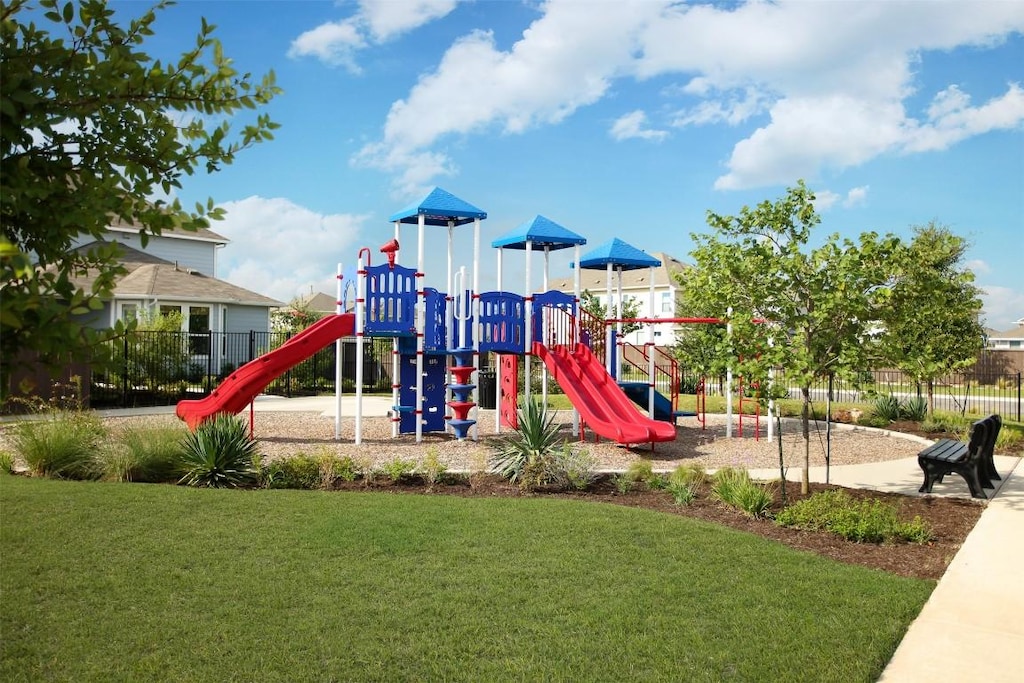 view of jungle gym featuring a lawn