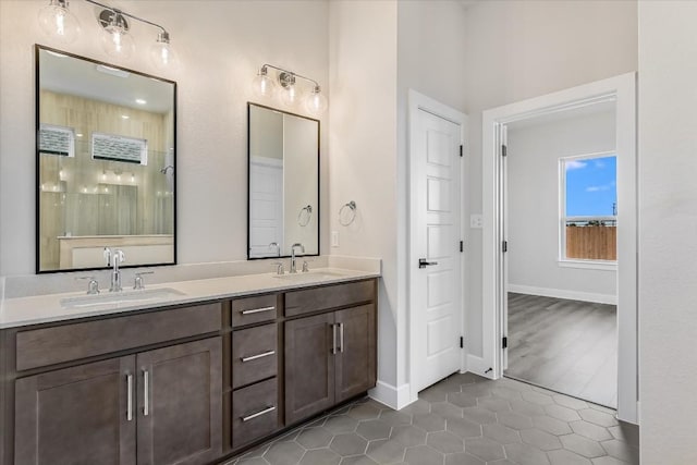 bathroom with vanity, tile patterned floors, and a shower