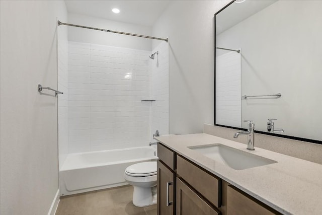 full bathroom with vanity, tiled shower / bath combo, and toilet