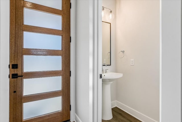 bathroom with hardwood / wood-style flooring