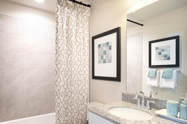 full bathroom with vanity, toilet, and shower / bath combo with shower curtain