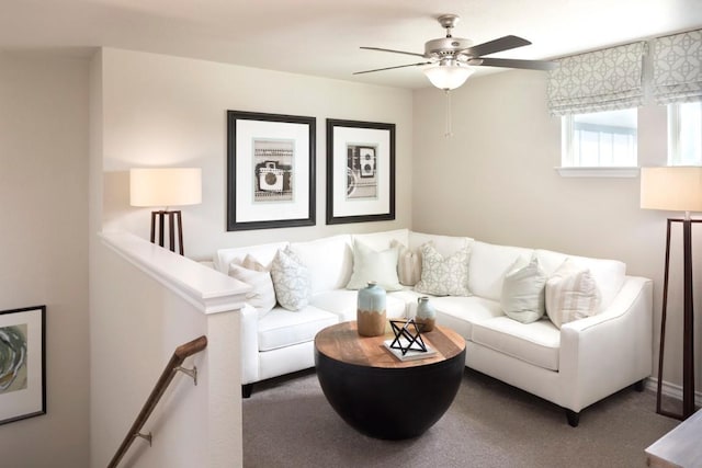 carpeted living room featuring ceiling fan