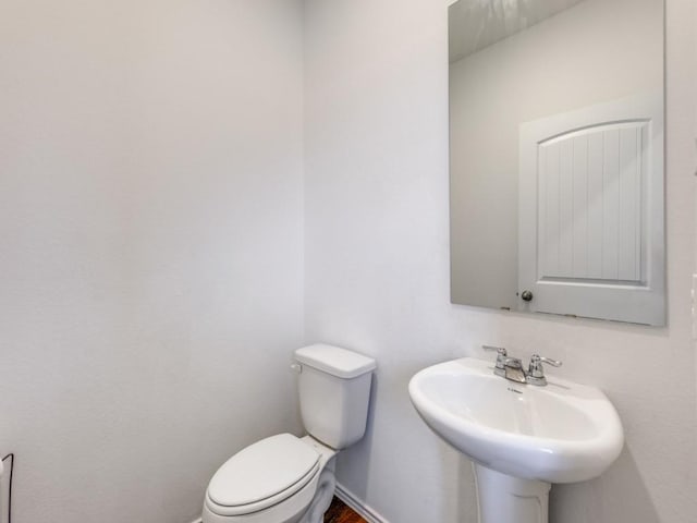 bathroom with sink and toilet