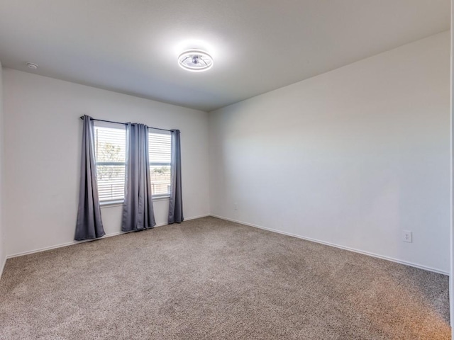 unfurnished room featuring carpet floors