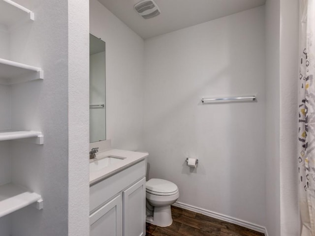 bathroom featuring a shower with curtain, vanity, toilet, and wood-type flooring