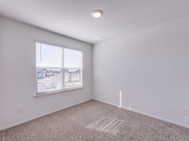 unfurnished room featuring carpet floors