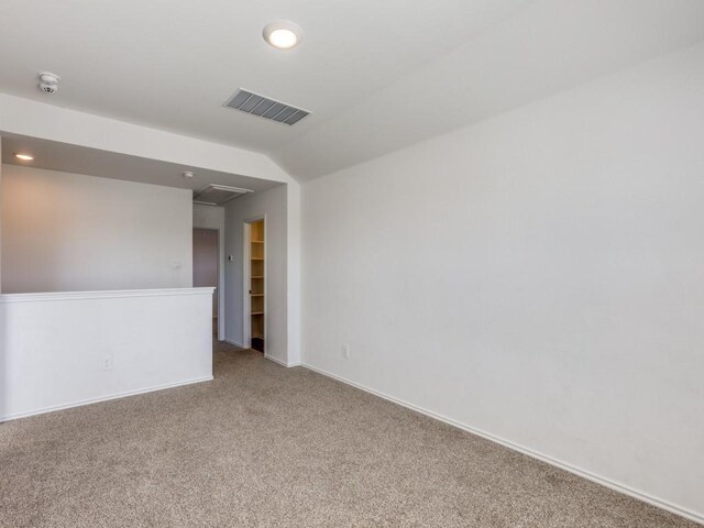 unfurnished room featuring carpet