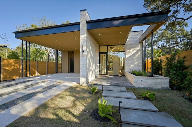 2423 S 5th St, Austin, TX 78704 - view of front facade with a chimney and a carport