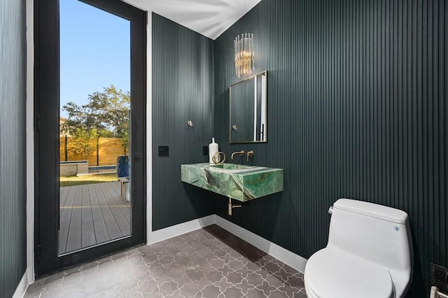 bathroom with plenty of natural light and toilet