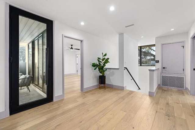 2423 S 5th St, Austin, TX 78704 - hall featuring an upstairs landing, light wood-style flooring, and recessed lighting