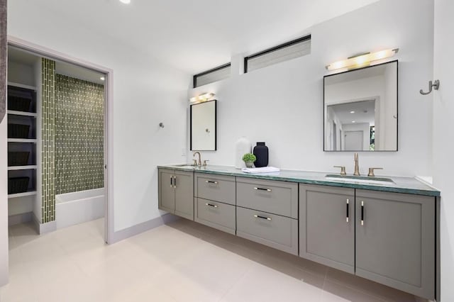 2423 S 5th St, Austin, TX 78704 - bathroom featuring double vanity, tile patterned flooring, and shower / tub combination