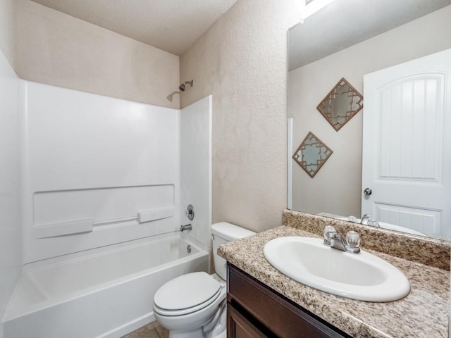 full bathroom featuring toilet, vanity, and tub / shower combination