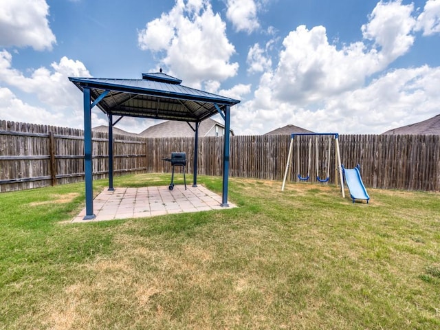 view of yard with a playground, a patio area, and a gazebo