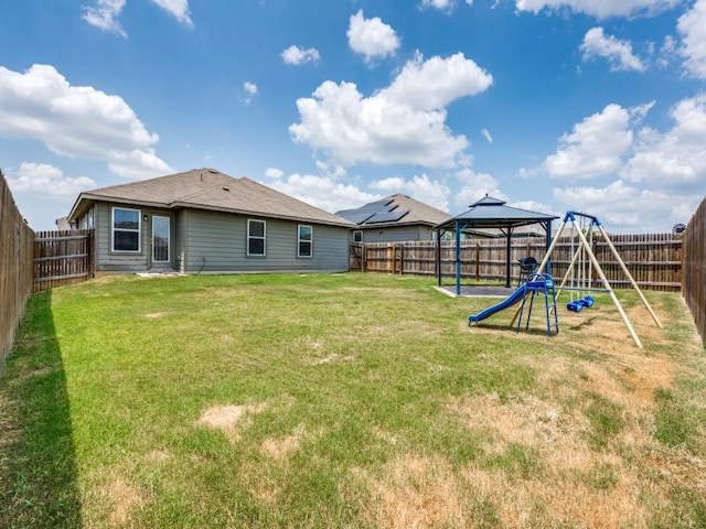 view of yard featuring a gazebo and a playground