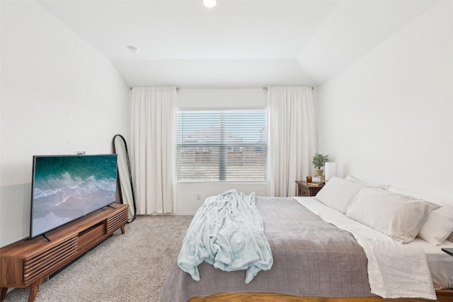 bedroom featuring carpet floors and vaulted ceiling