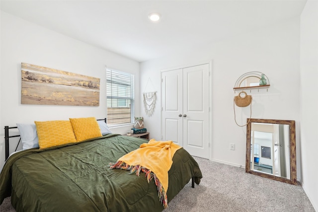 bedroom with carpet floors and a closet