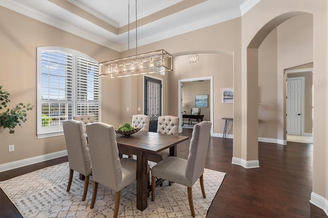 dining room with dark hardwood / wood-style floors and ornamental molding