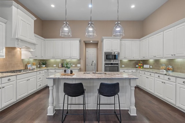 kitchen with white cabinets, dark hardwood / wood-style floors, sink, and stainless steel appliances