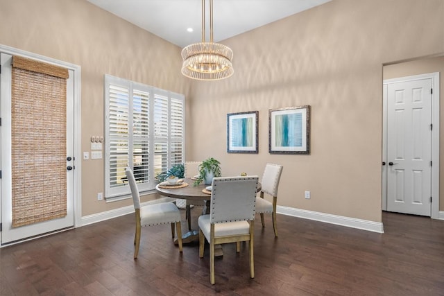 dining area featuring a chandelier and dark hardwood / wood-style floors