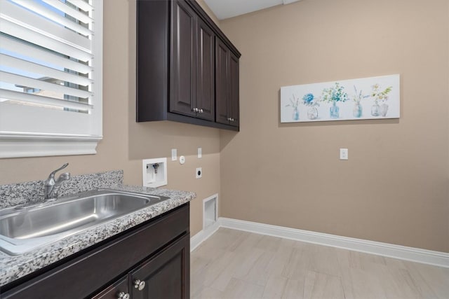 clothes washing area with cabinets, hookup for a washing machine, electric dryer hookup, and sink