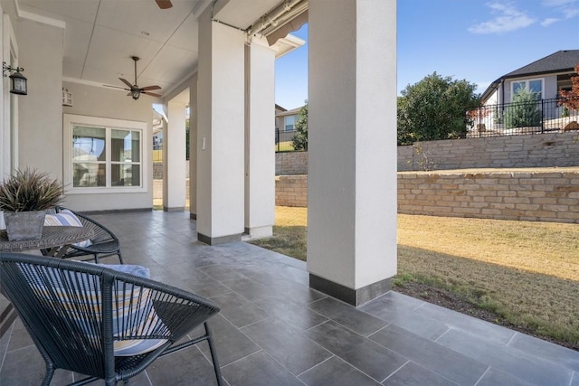 view of patio featuring ceiling fan