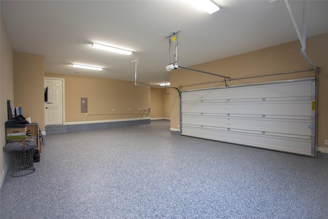 garage featuring a garage door opener and electric panel