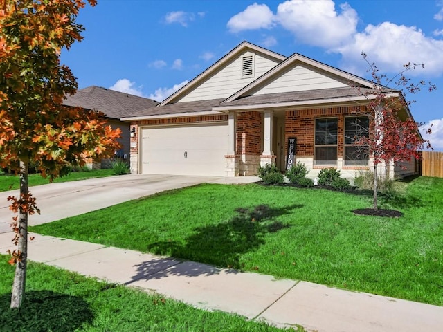 view of front of property featuring a front lawn and a garage