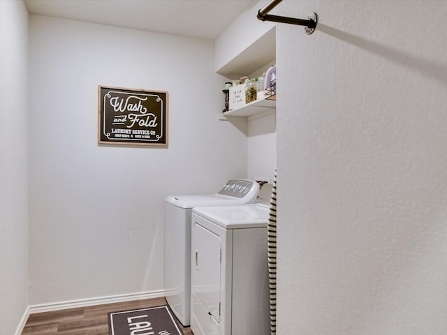 washroom featuring washer and dryer and hardwood / wood-style floors