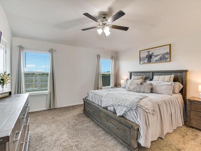 1640 T H Johnson Dr, Taylor, TX 76574 - bedroom with light colored carpet, multiple windows, and a ceiling fan
