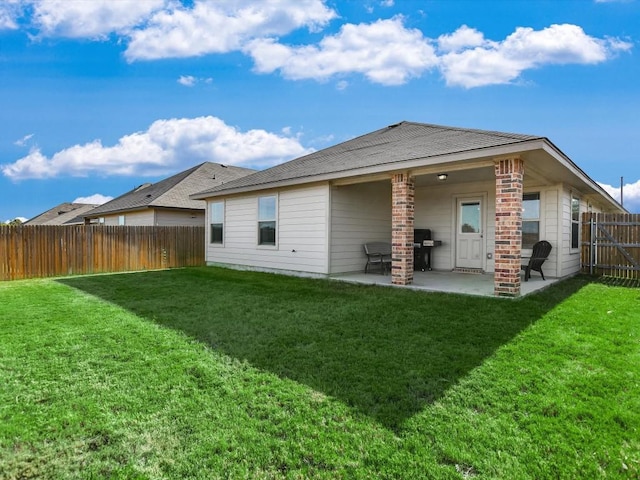 1640 T H Johnson Dr, Taylor, TX 76574 - back of house with a patio area and a fenced backyard